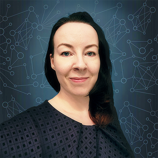 A headshot of Katie with a blue background.